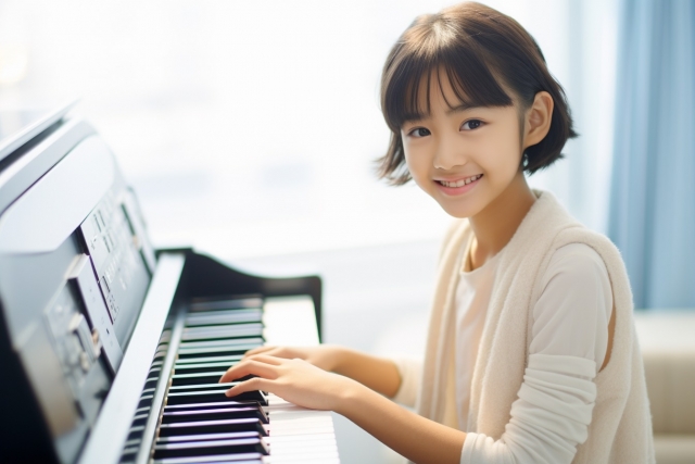 ピアノと女の子の写真画像